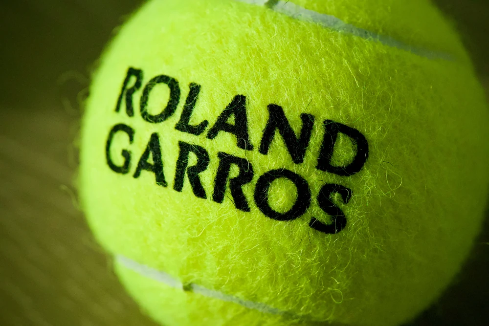 A tennis ball with Roland Garros on it