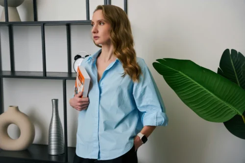 Woman wearing a linen button-up shirt