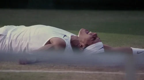 Nadal celebrating his first Wimbledon win after a grueling match