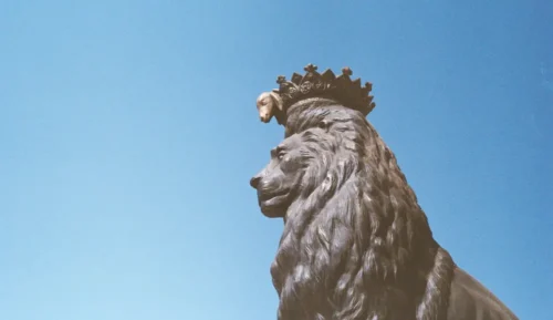 Leo with a crown and a companion